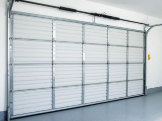 DIY Garage Door Maintenance Tips Clermont FL Closed garage door with clean interior showing safe and well-maintained system in Clermont, FL
